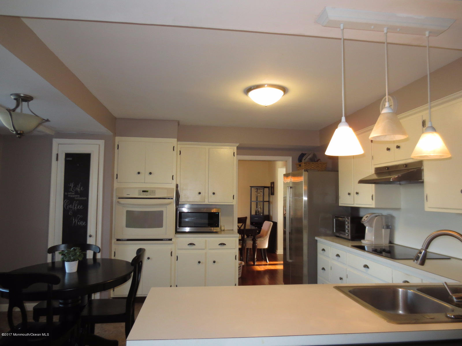 131 Ravine Drive Matawan, NJ 07747 - Photo 7 of 23 a kitchen with stainless steel appliances a refrigerator sink and microwave