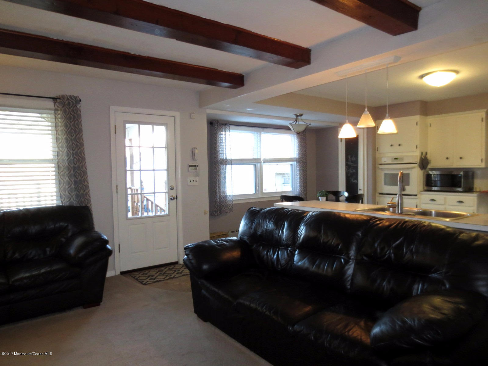 131 Ravine Drive Matawan, NJ 07747 - Photo 8 of 23 a living room with furniture and a window