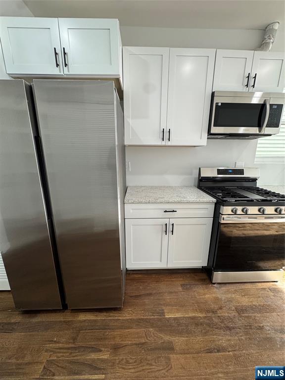 196 Malvern Street, Unit 2 Newark, NJ 07105 - Photo 4 of 16 a kitchen with stainless steel appliances a refrigerator stove and sink