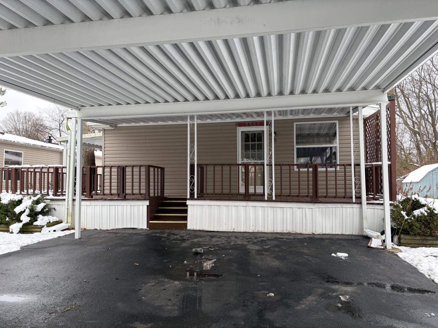 35 Court Road Richmond, IN 47374 - Photo 15 of 22 Covered Parking and covered wrap around deck.