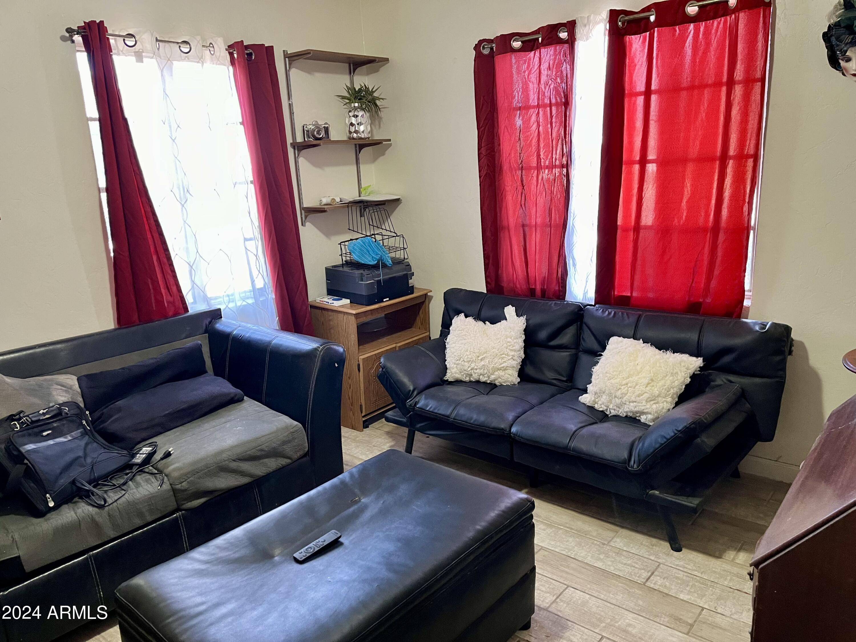 1517 East 9th Street Douglas, AZ 85607 - Photo 13 of 16 a living room with furniture and a window