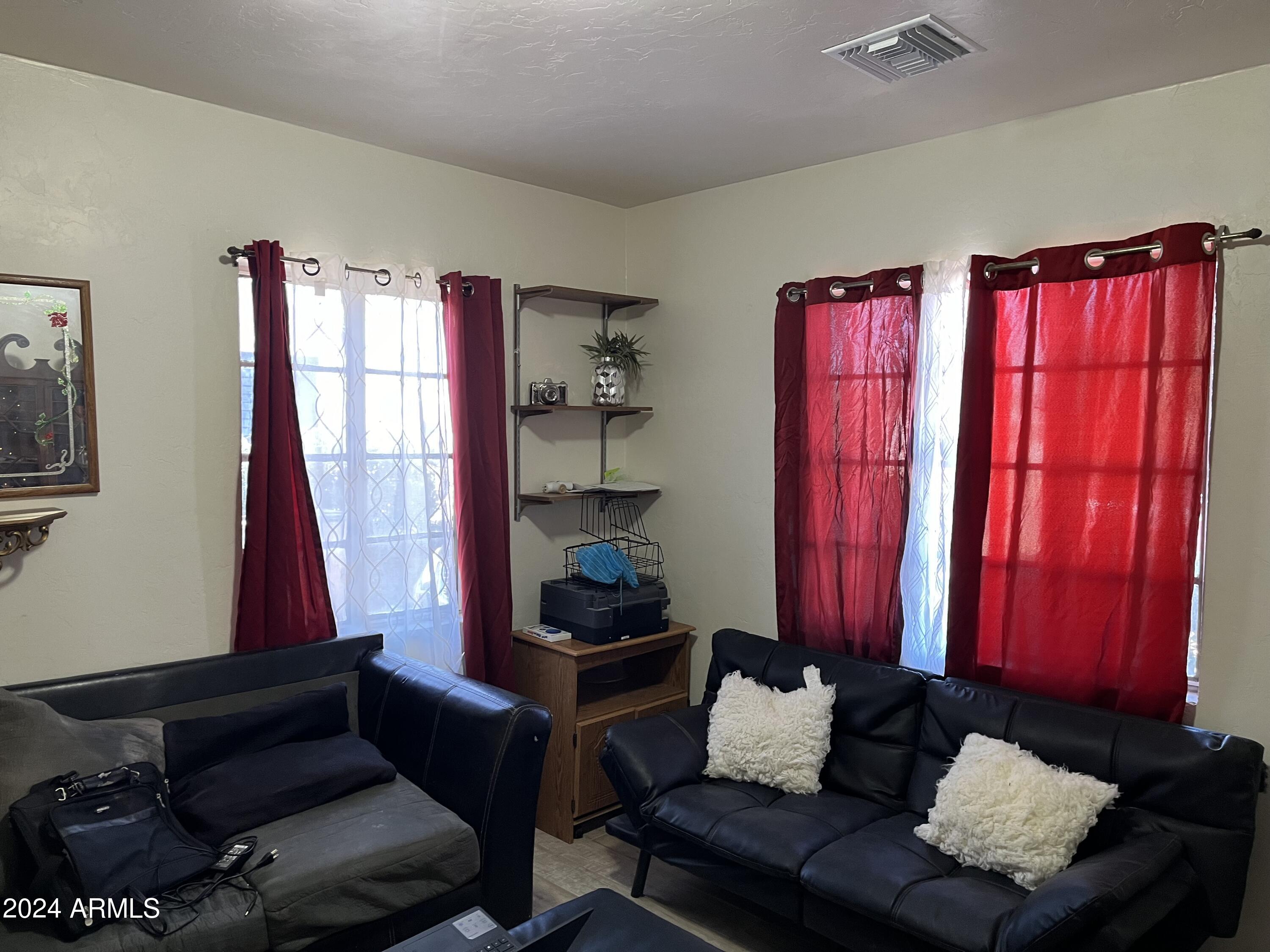1517 East 9th Street Douglas, AZ 85607 - Photo 14 of 16 a living room with furniture and a window