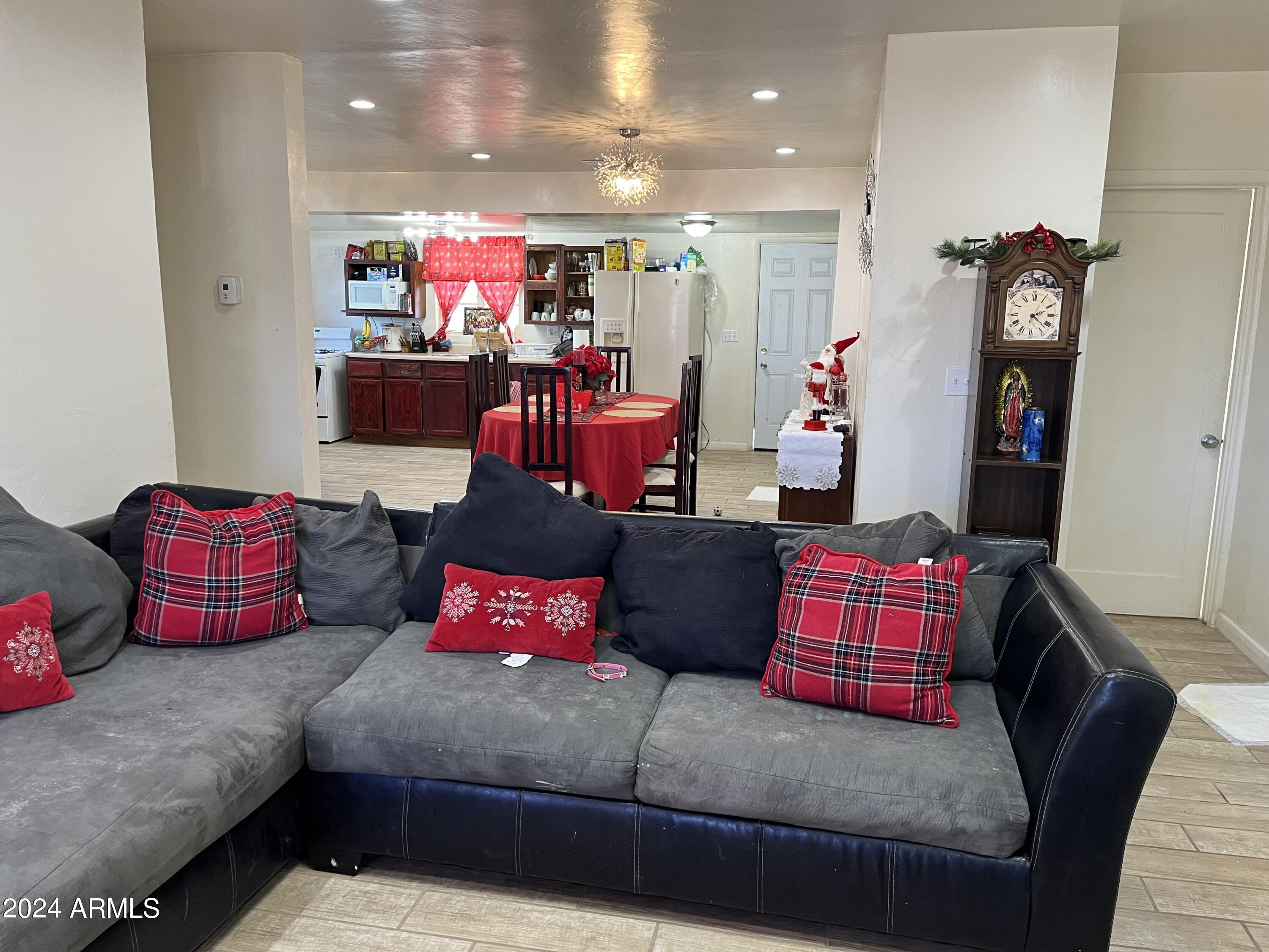 1517 East 9th Street Douglas, AZ 85607 - Photo 5 of 16 a living room with furniture and a flat screen tv