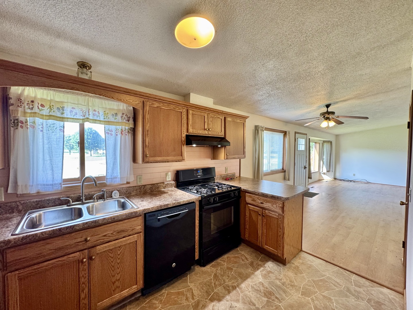 602 East Cherry Avenue Cherry, IL 61317 - Photo 11 of 21 a kitchen with stainless steel appliances granite countertop a sink stove and cabinets