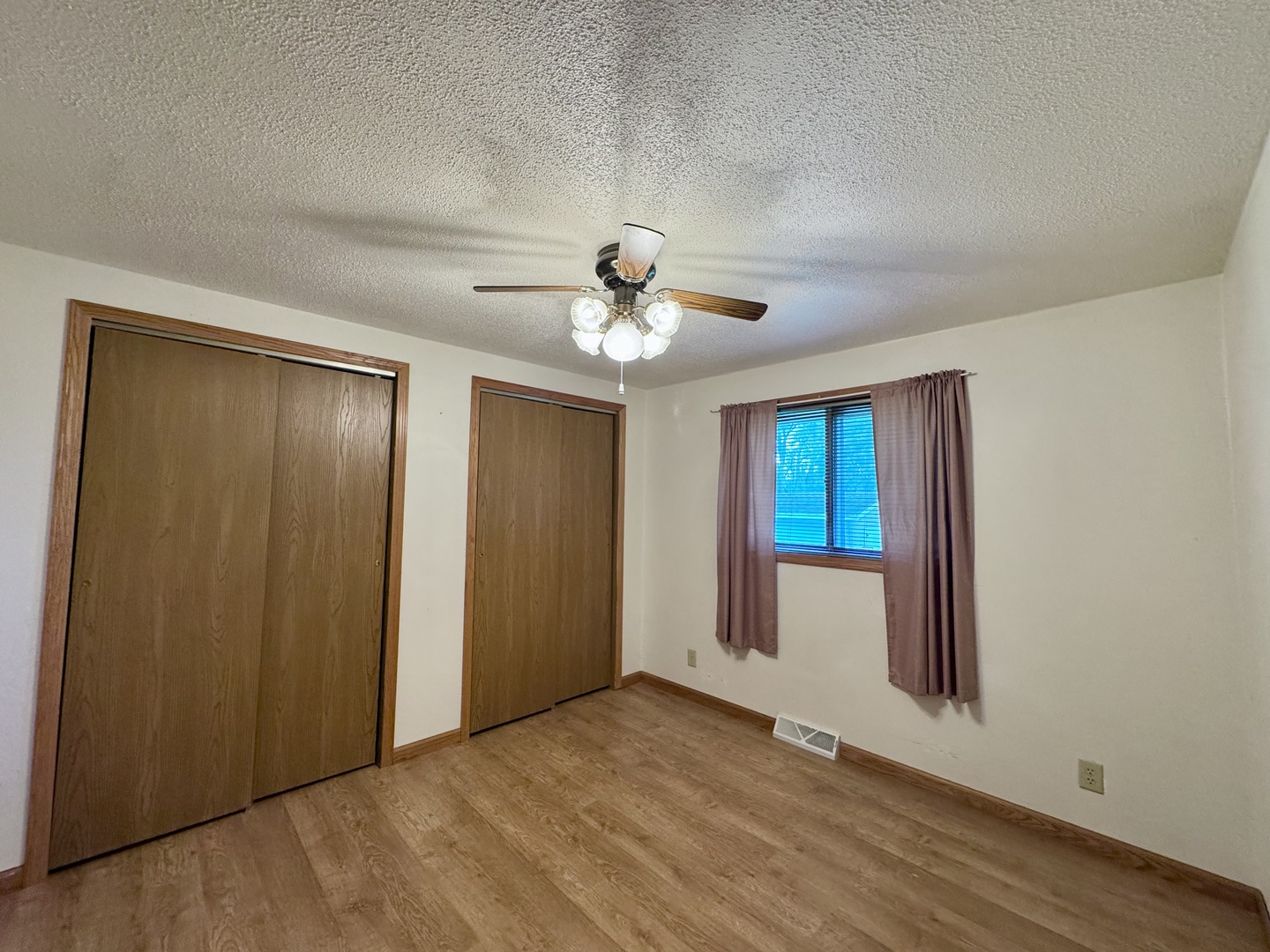 602 East Cherry Avenue Cherry, IL 61317 - Photo 12 of 21 a view of an empty room with a ceiling fan