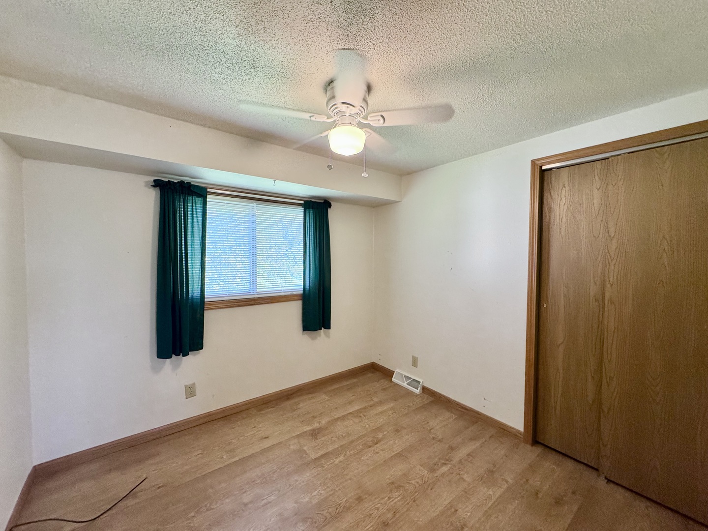 602 East Cherry Avenue Cherry, IL 61317 - Photo 14 of 21 an empty room with closet and a chandelier fan