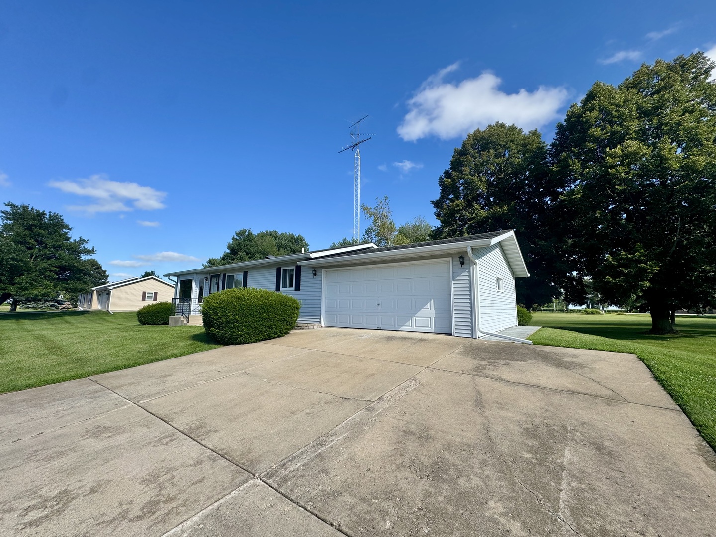 602 East Cherry Avenue Cherry, IL 61317 - Photo 2 of 21 a view of yellow house with a yard and large tree
