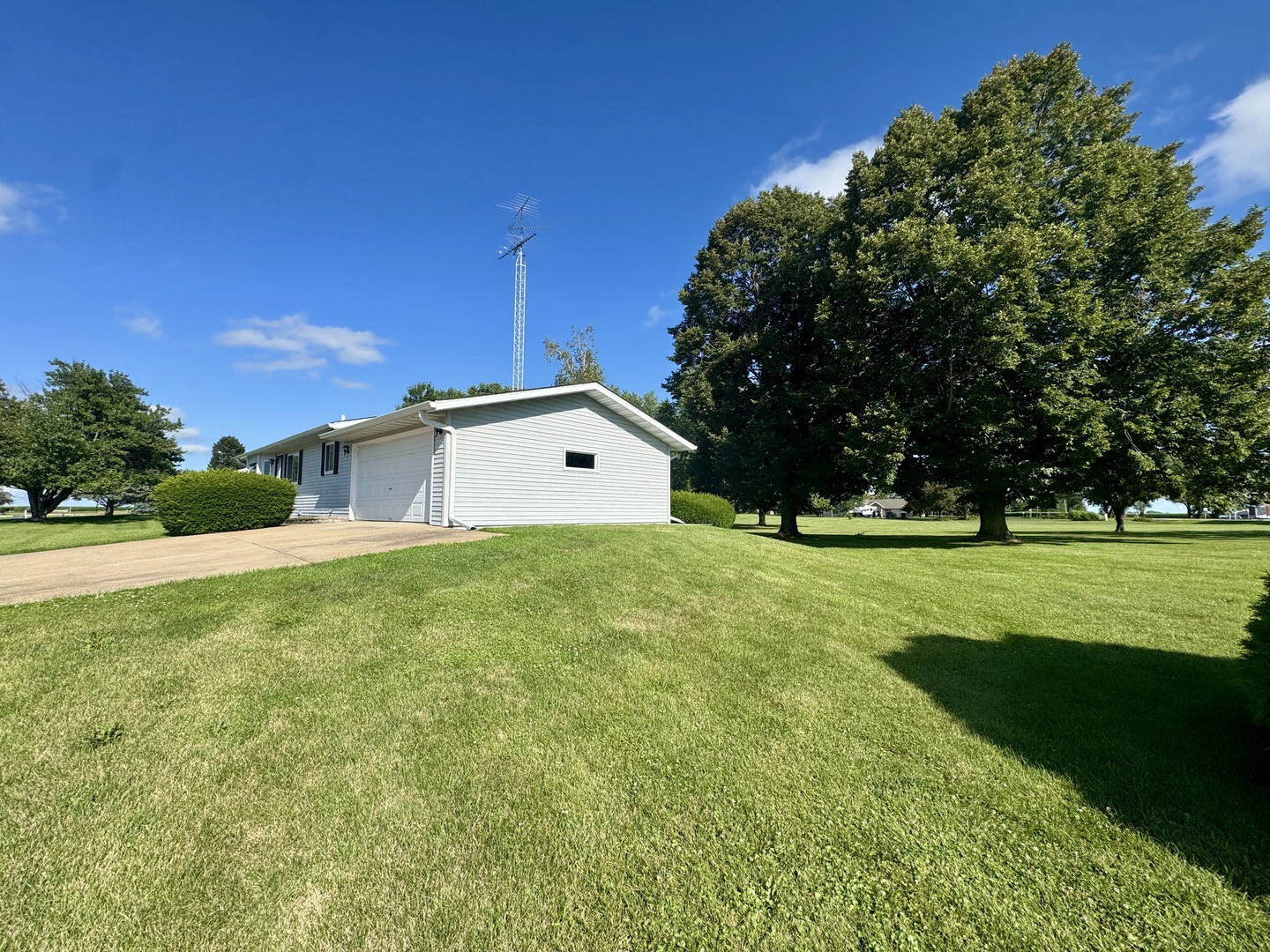 602 East Cherry Avenue Cherry, IL 61317 - Photo 3 of 21 a front view of house with a garden and trees