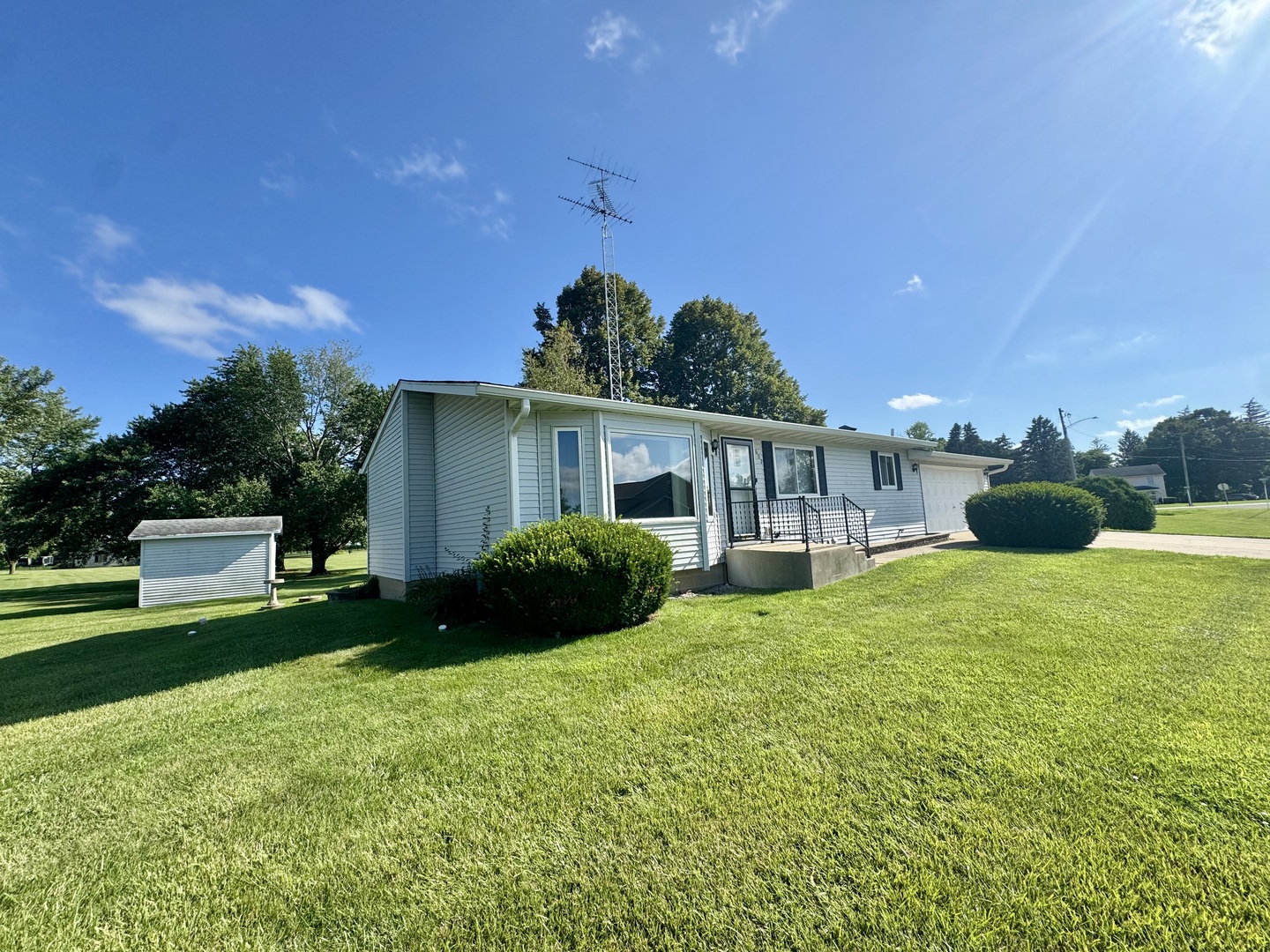 602 East Cherry Avenue Cherry, IL 61317 - Photo 7 of 21 a view of a house with backyard sitting area and garden