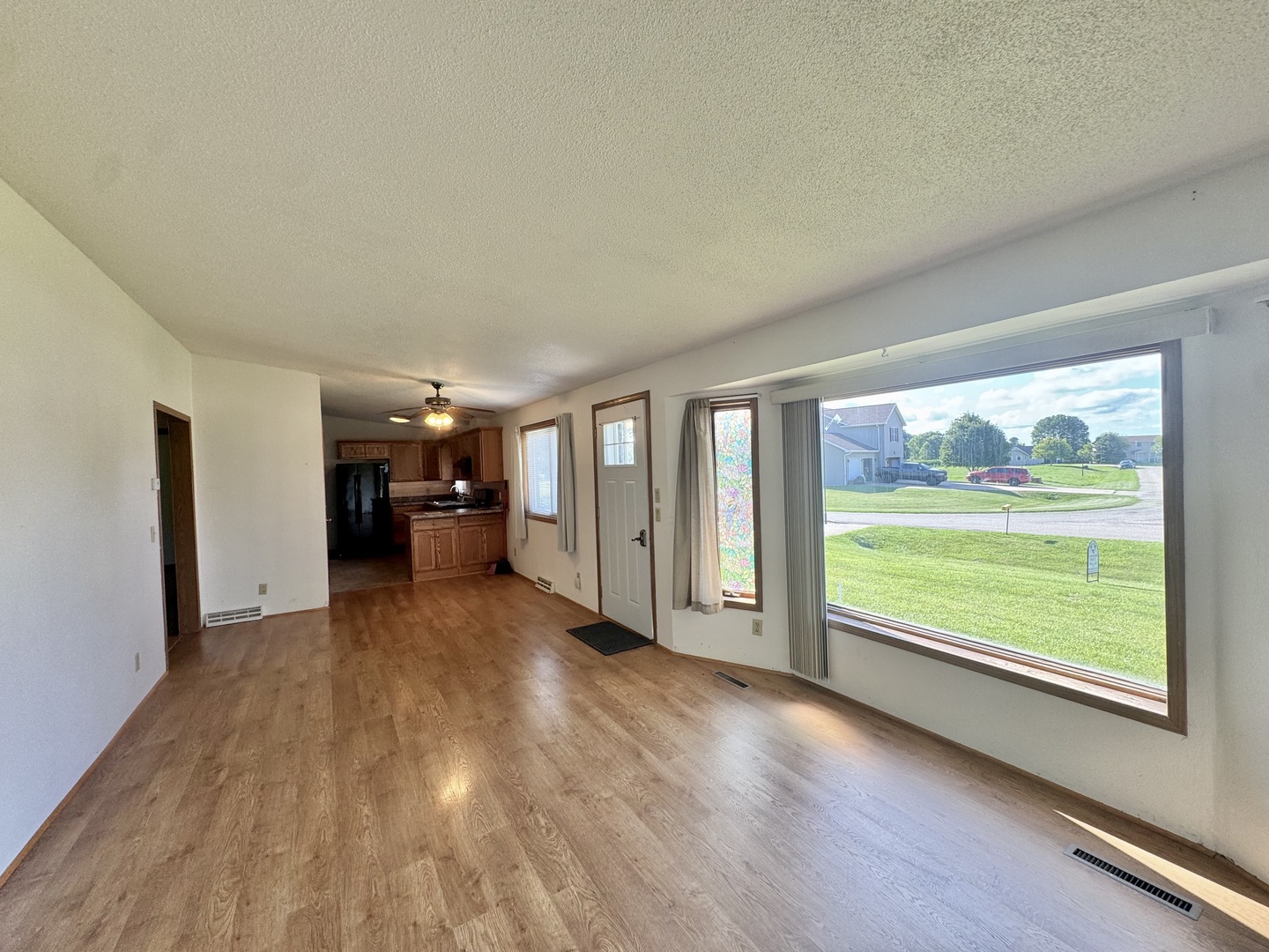 602 East Cherry Avenue Cherry, IL 61317 - Photo 10 of 21 a view of empty room with wooden floor and fireplace