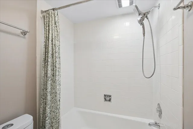 a bathroom with a shower curtain