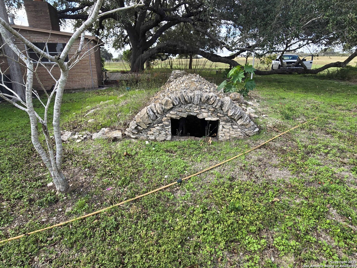1173 Charco Road Beeville, TX 78102 - Photo 14 of 39 a view of a house with a yard