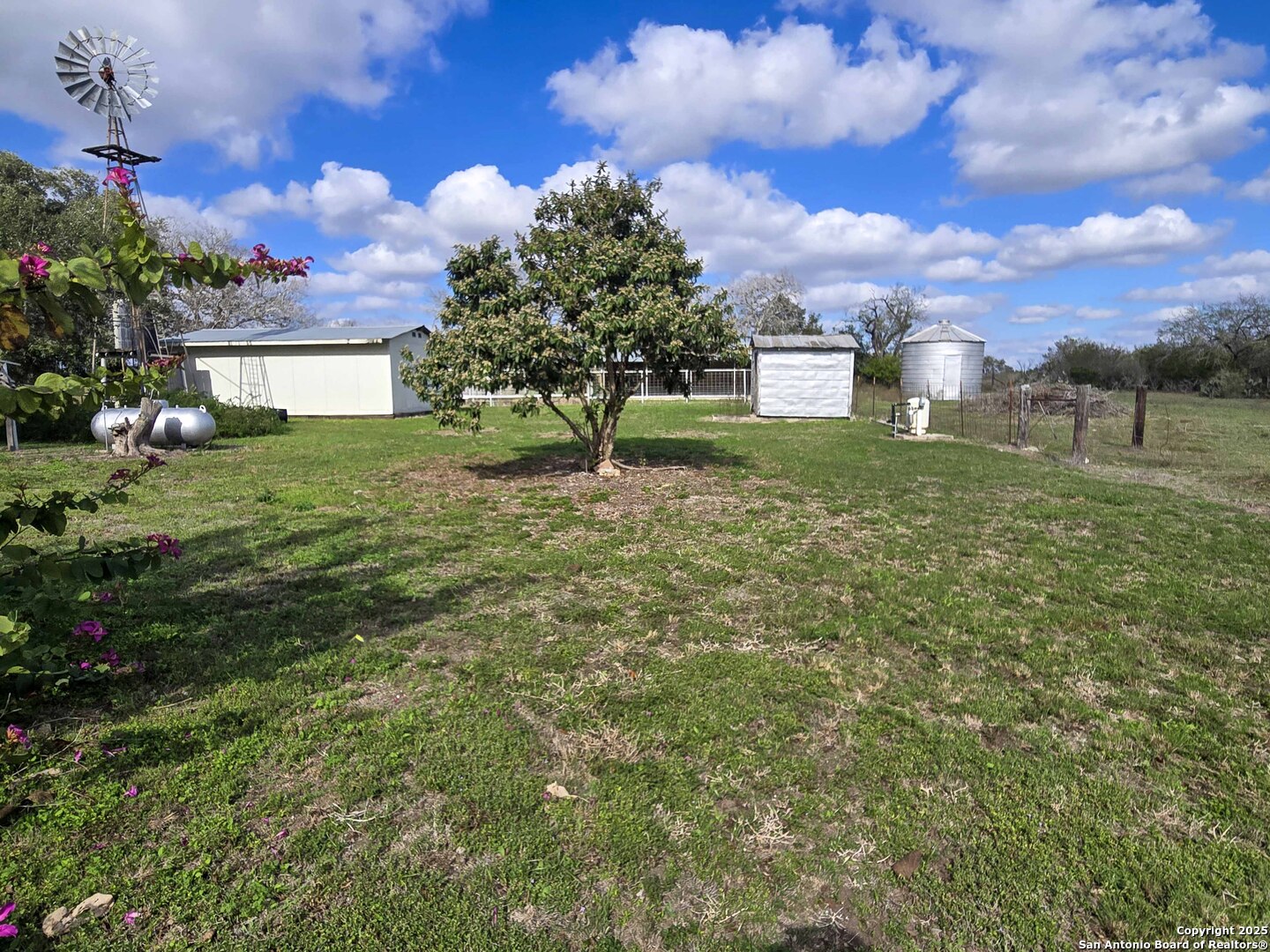 1173 Charco Road Beeville, TX 78102 - Photo 18 of 39 a view of a house with a yard