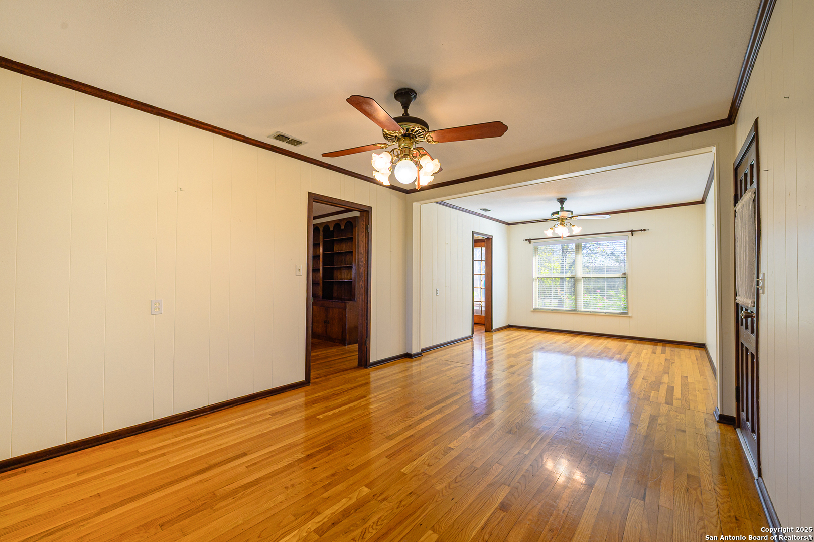 1173 Charco Road Beeville, TX 78102 - Photo 29 of 39 a view of an empty room with wooden floor and a window