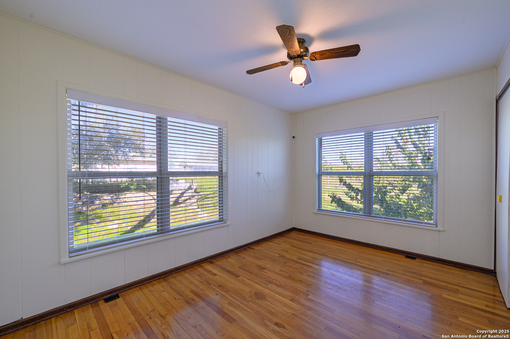 1173 Charco Road Beeville, TX 78102 - Photo 34 of 39 a view of an empty room with wooden floor and a window