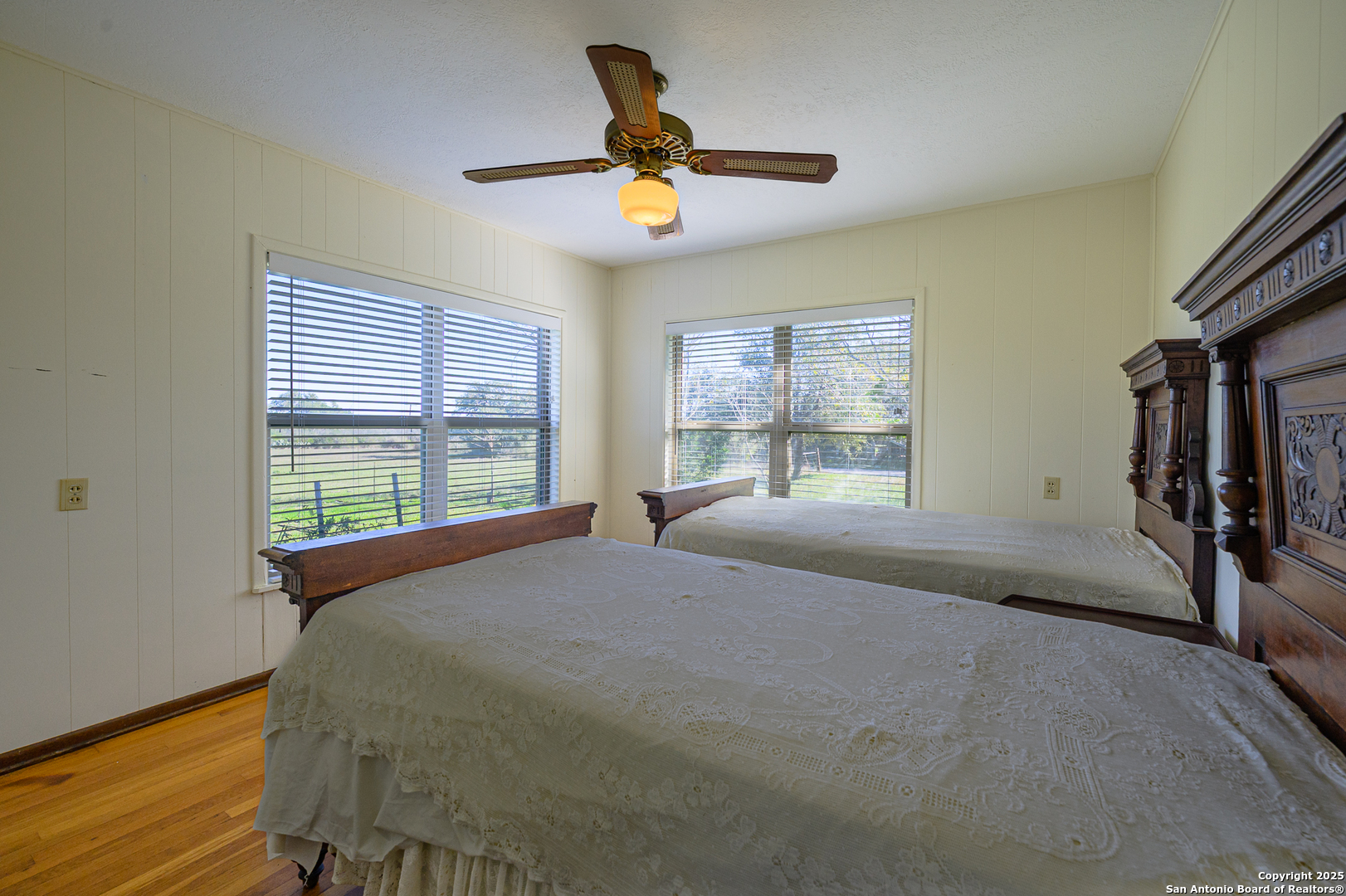 1173 Charco Road Beeville, TX 78102 - Photo 35 of 39 a bed sitting in a bedroom next to a window