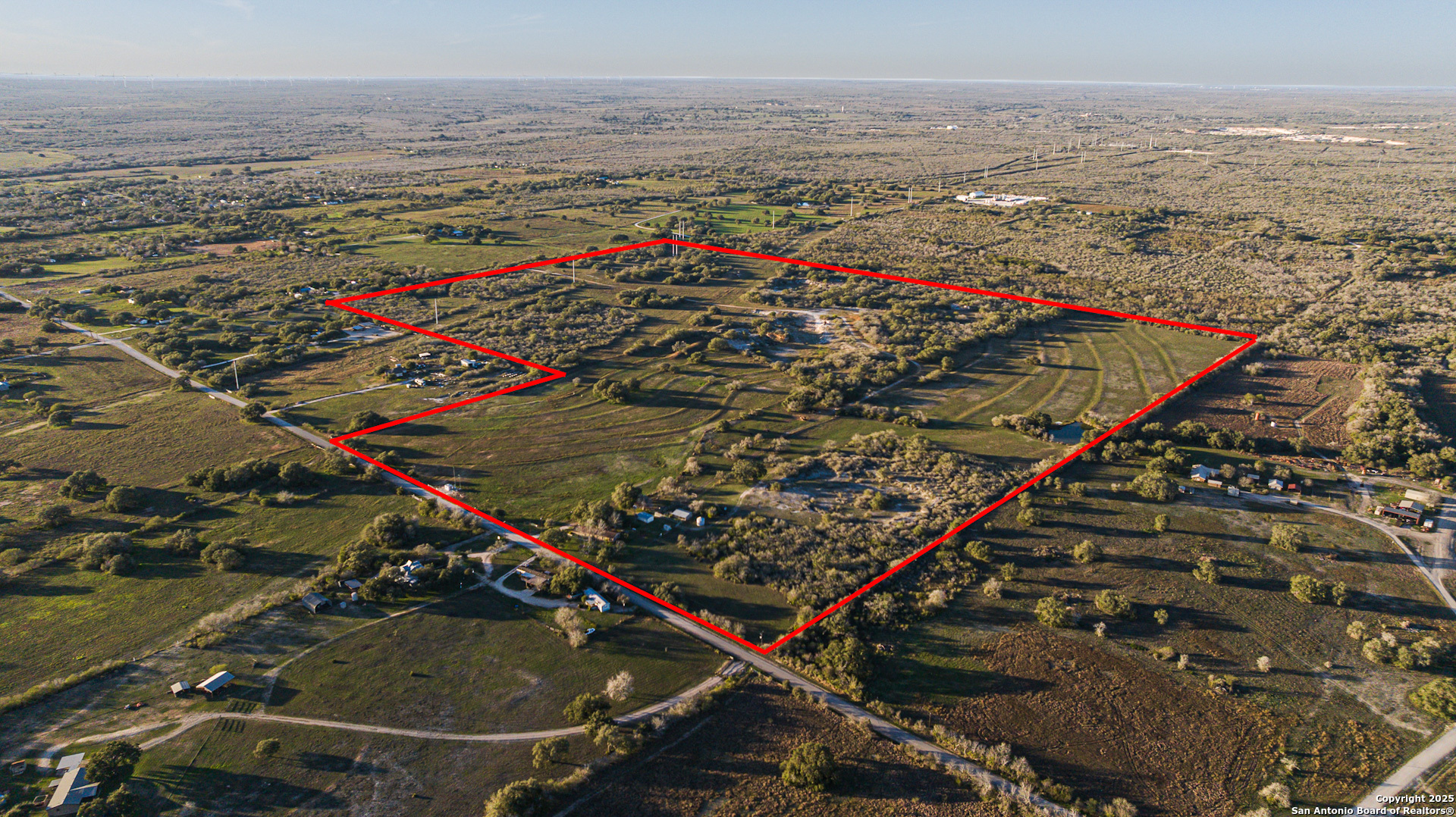 1173 Charco Road Beeville, TX 78102 - Photo 4 of 39 an outdoor view of a building with an ocean view