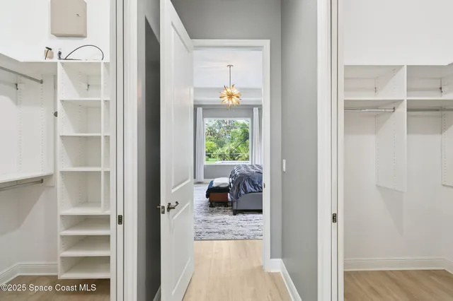 a view of bedroom with wooden floor and window