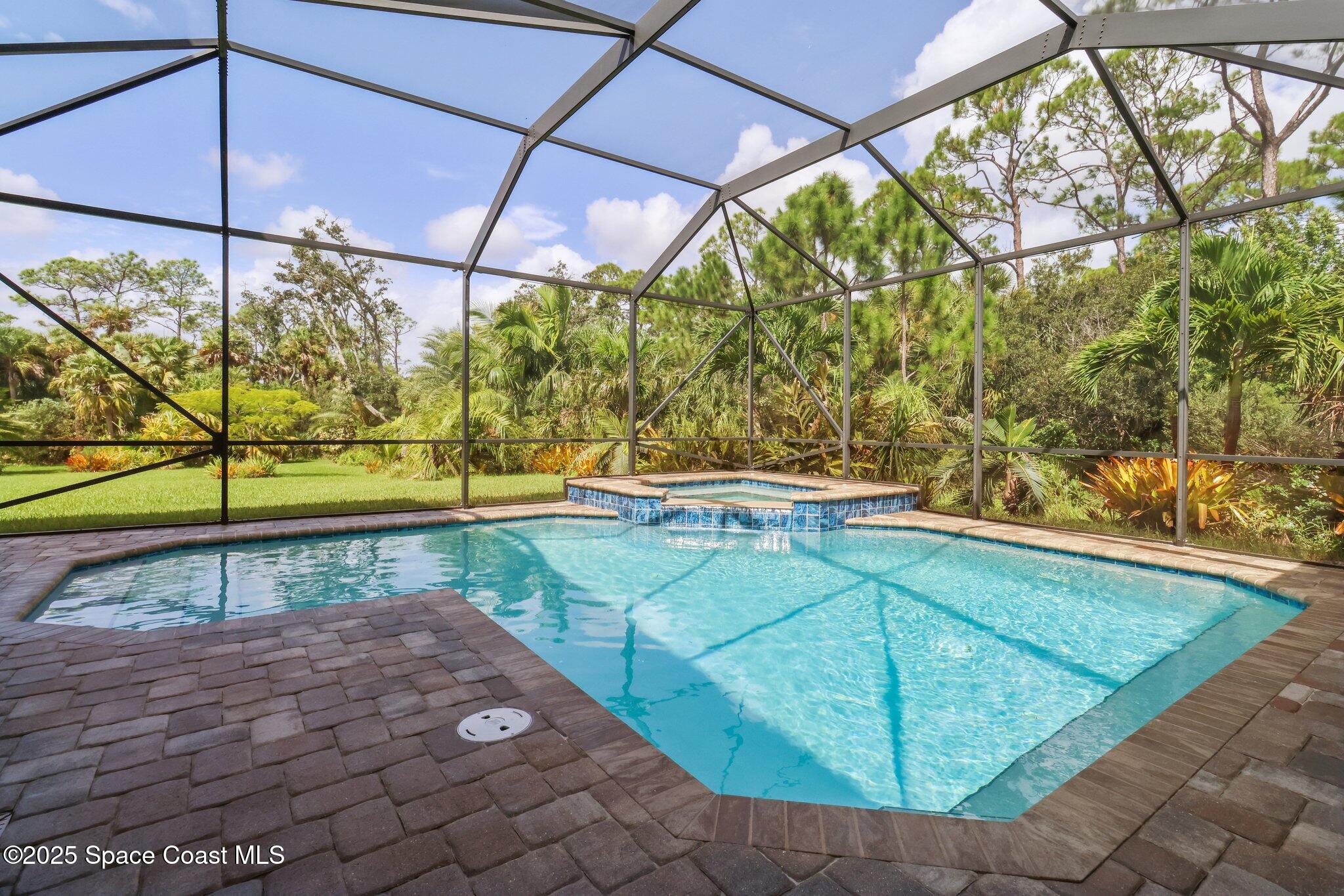 4437 Preservation Circle Melbourne, FL 32934 - Photo 24 of 40 a view of a backyard with an outdoor space
