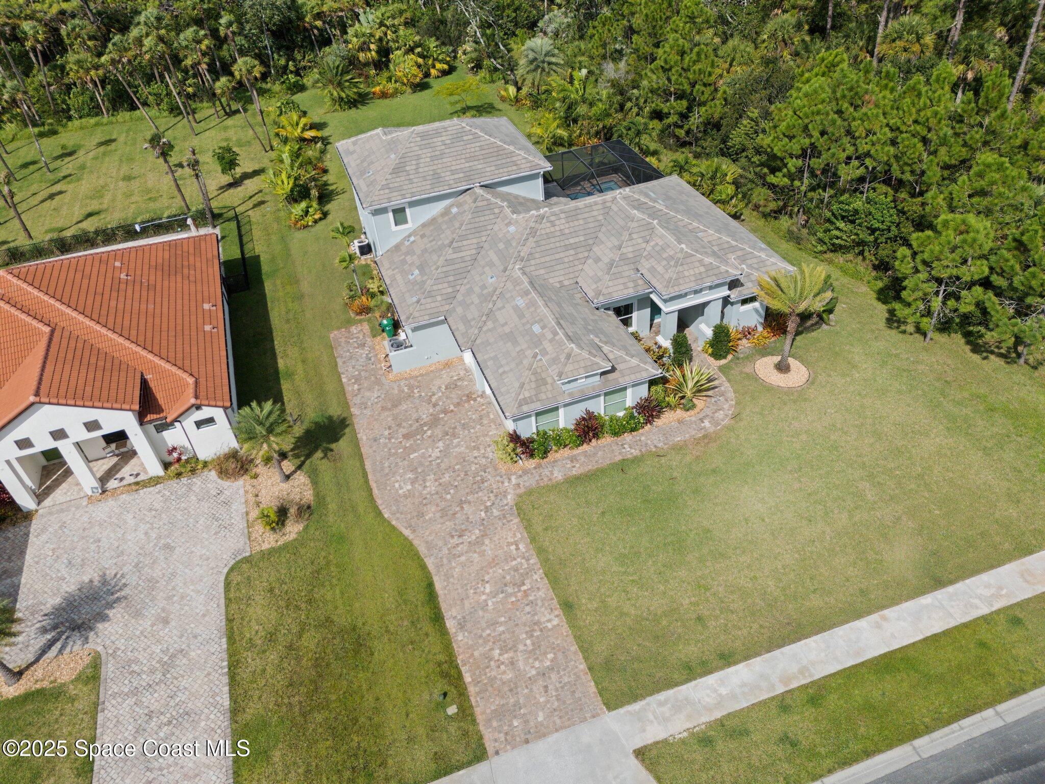 4437 Preservation Circle Melbourne, FL 32934 - Photo 34 of 40 an aerial view of a house with outdoor space