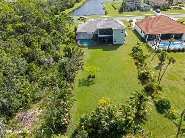 a aerial view of a house with a yard