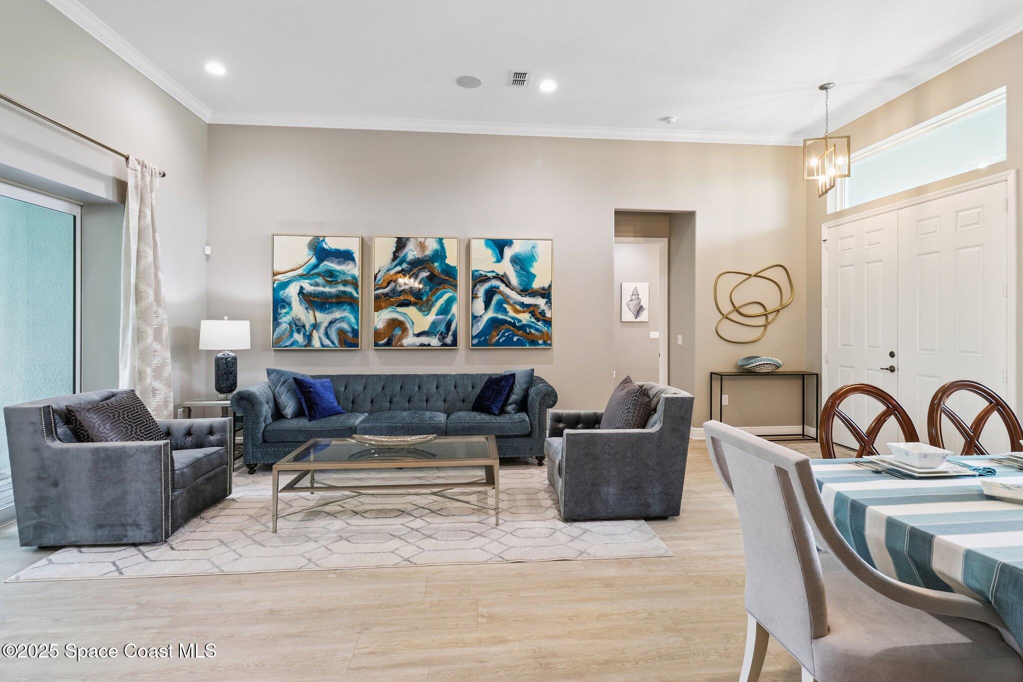 4437 Preservation Circle Melbourne, FL 32934 - Photo 4 of 40 a living room with furniture and a couch