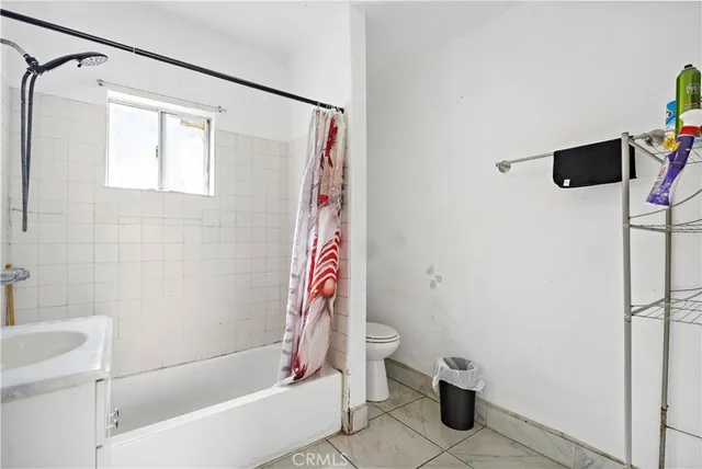 a bathroom with a shower and a toilet