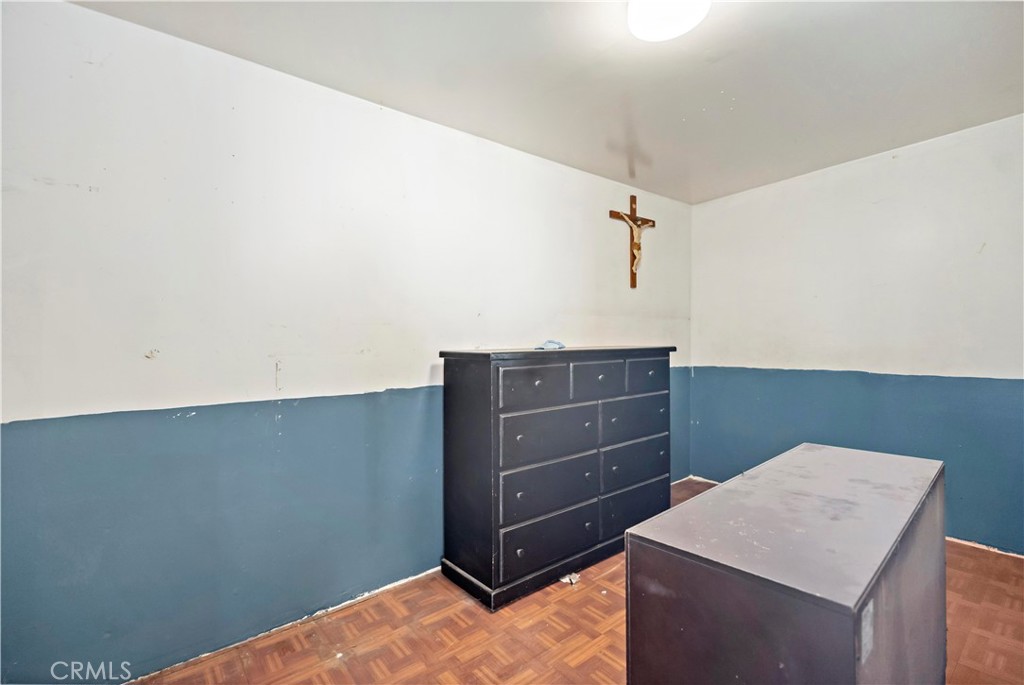 309 North Willowbrook Avenue Compton, CA 90220 - Photo 22 of 24 a room that has a dresser in it