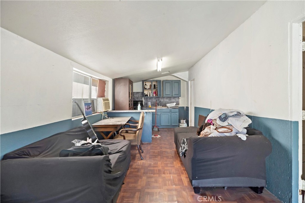 309 North Willowbrook Avenue Compton, CA 90220 - Photo 23 of 24 a living room with furniture and a couch