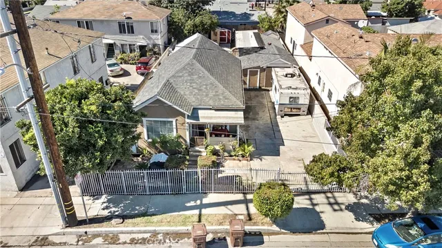 a aerial view of a house with a yard