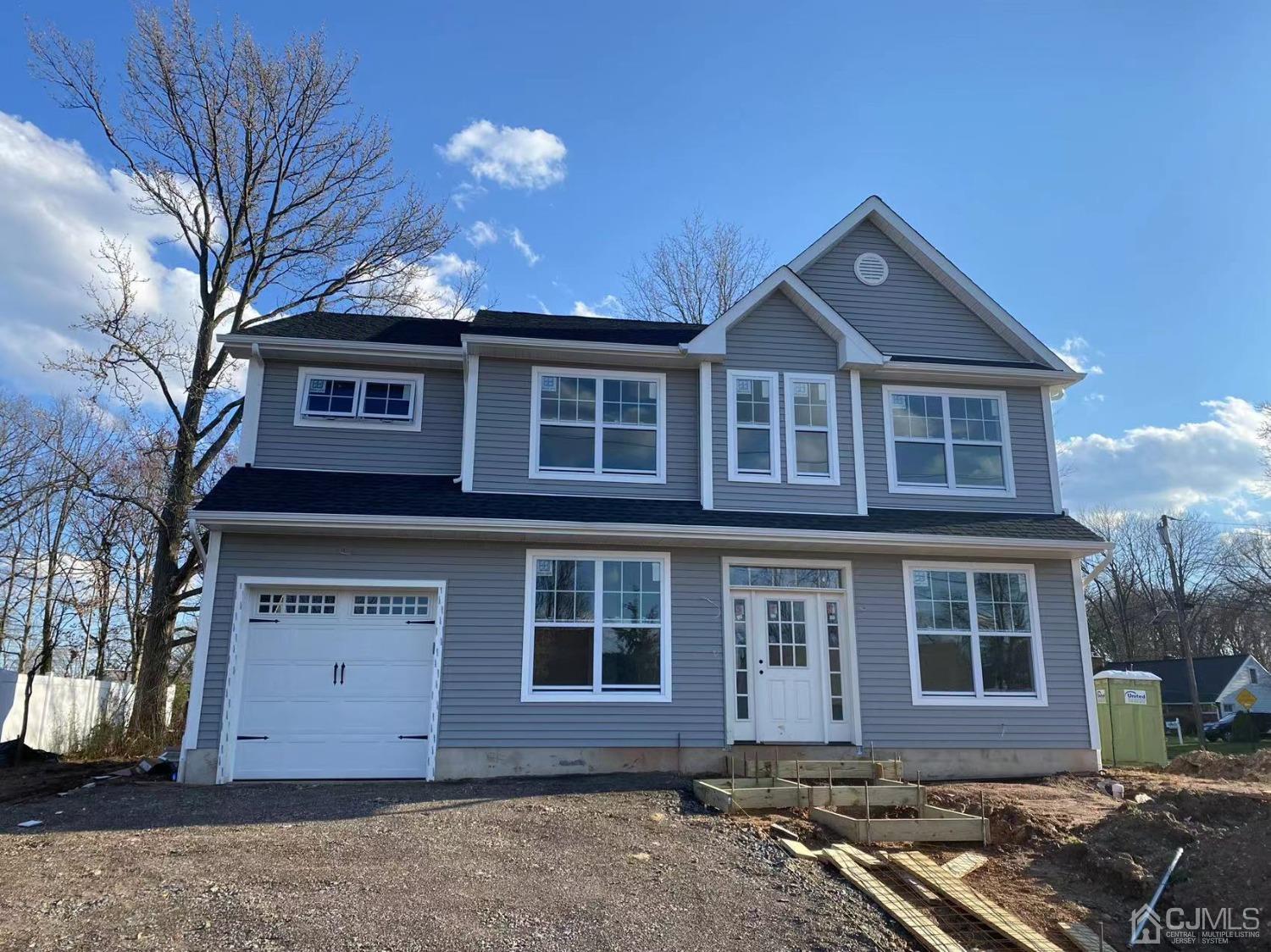 12 Ashley Road Edison, NJ 08817 - Photo 1 of 1 a front view of a house with a yard