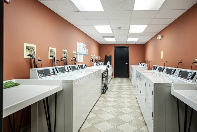 a kitchen with a sink a counter top space and appliances
