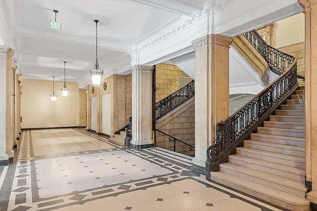a view of a entryway door an empty room and wooden floor