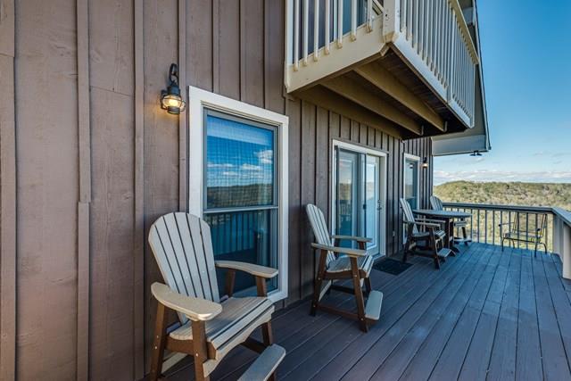 11775 Fox Hill Road Baxter, TN 38544 - Photo 14 of 19 a view of a balcony with chairs and wooden floor