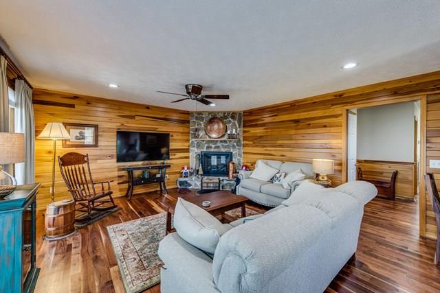11775 Fox Hill Road Baxter, TN 38544 - Photo 8 of 19 a living room with furniture flat screen tv and a fireplace