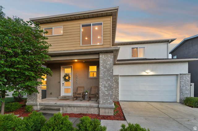 4595 College Ridge Court Millcreek, UT 84117 - Photo 39 of 57 Contemporary two-story residence featuring a covered front porch with stone-clad columns