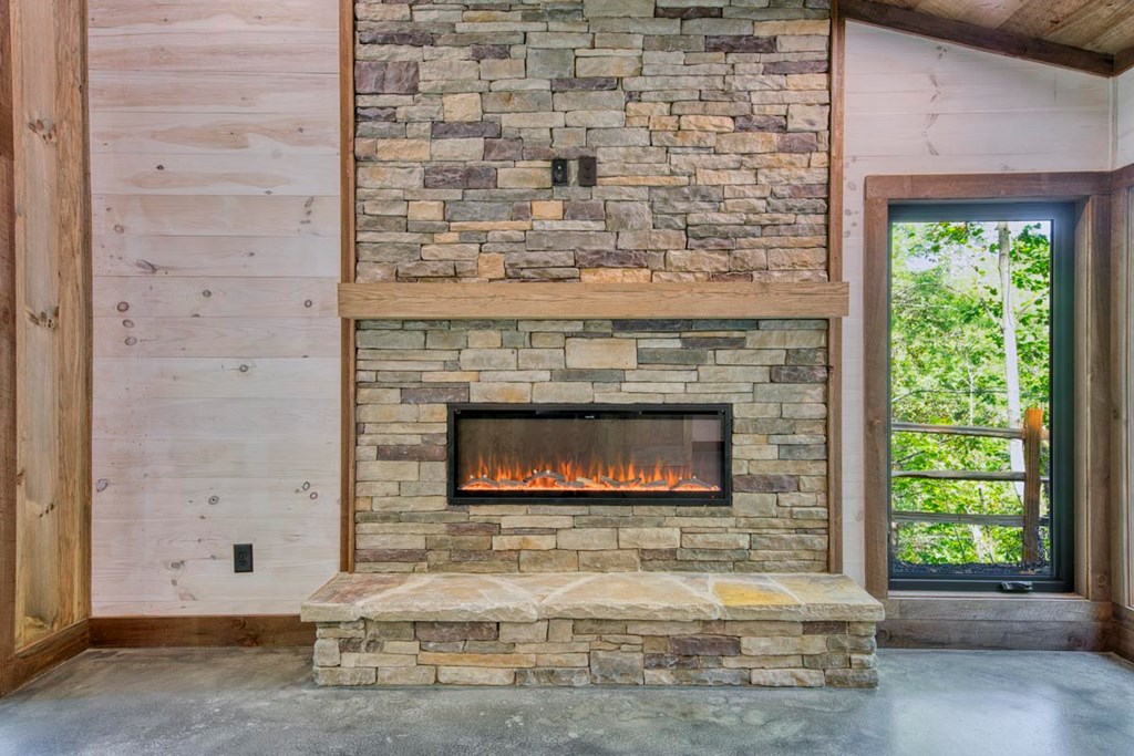 1241 Mountain Tops Road Blue Ridge, GA 30513 - Photo 25 of 31 a living room with a fireplace and a fireplace