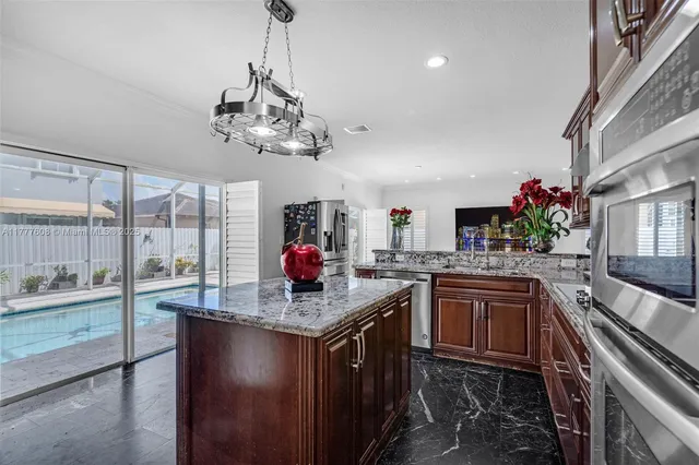 a kitchen with a sink and stove