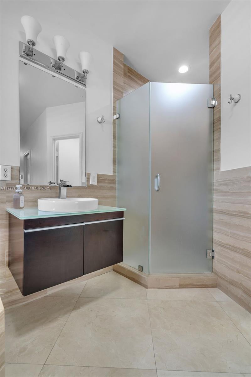 16075 Southwest 149th Terrace Miami, FL 33196 - Photo 21 of 46 a bathroom with a bathtub sink vanity granite and shower