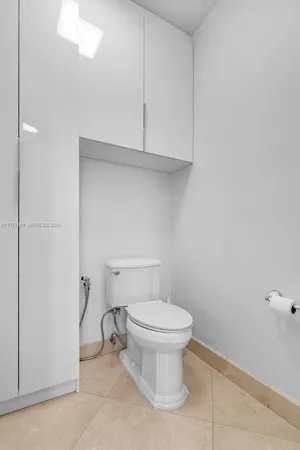 a bathroom with a toilet and a sink