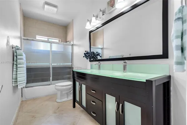 a bathroom with a sink and mirror