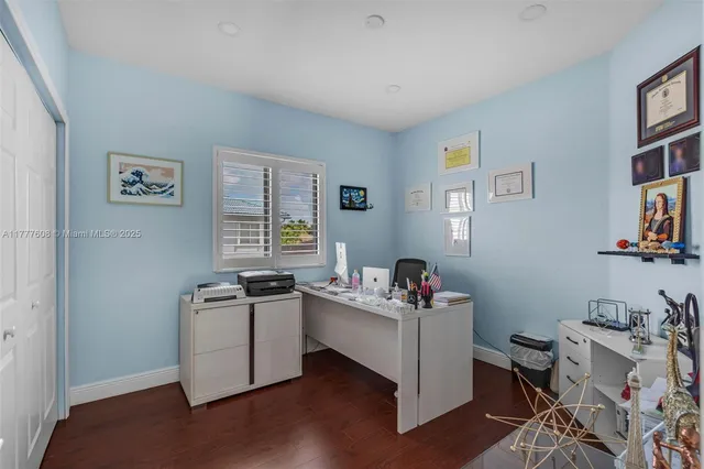a living room with a couch and a dresser next to a window