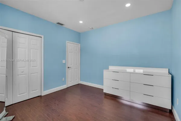 an empty room with wooden floor