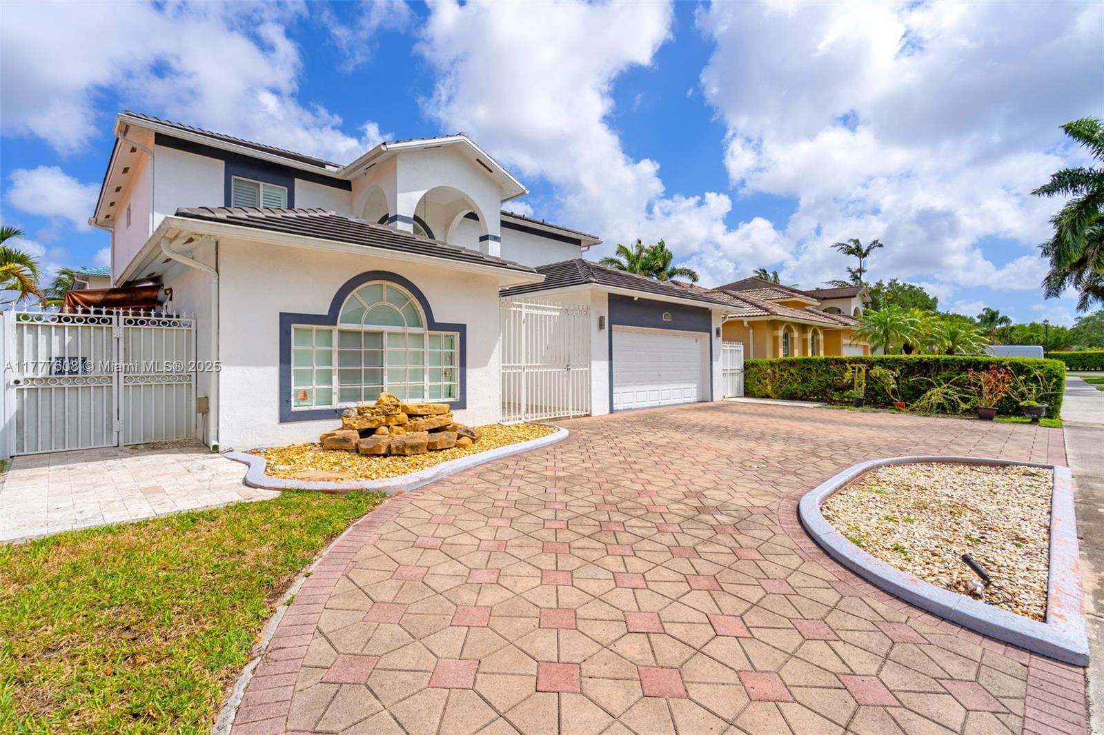 16075 Southwest 149th Terrace Miami, FL 33196 - Photo 3 of 46 a front view of a house with garden