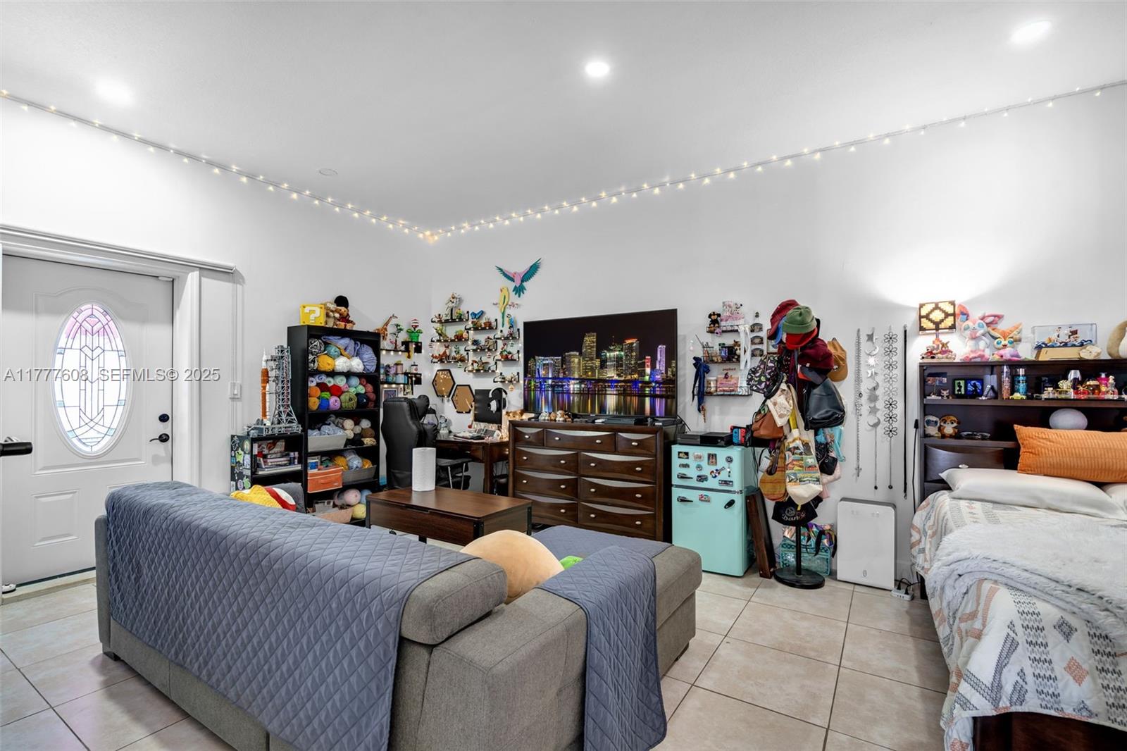 16075 Southwest 149th Terrace Miami, FL 33196 - Photo 33 of 46 a living room with lots of furniture and a kitchen view