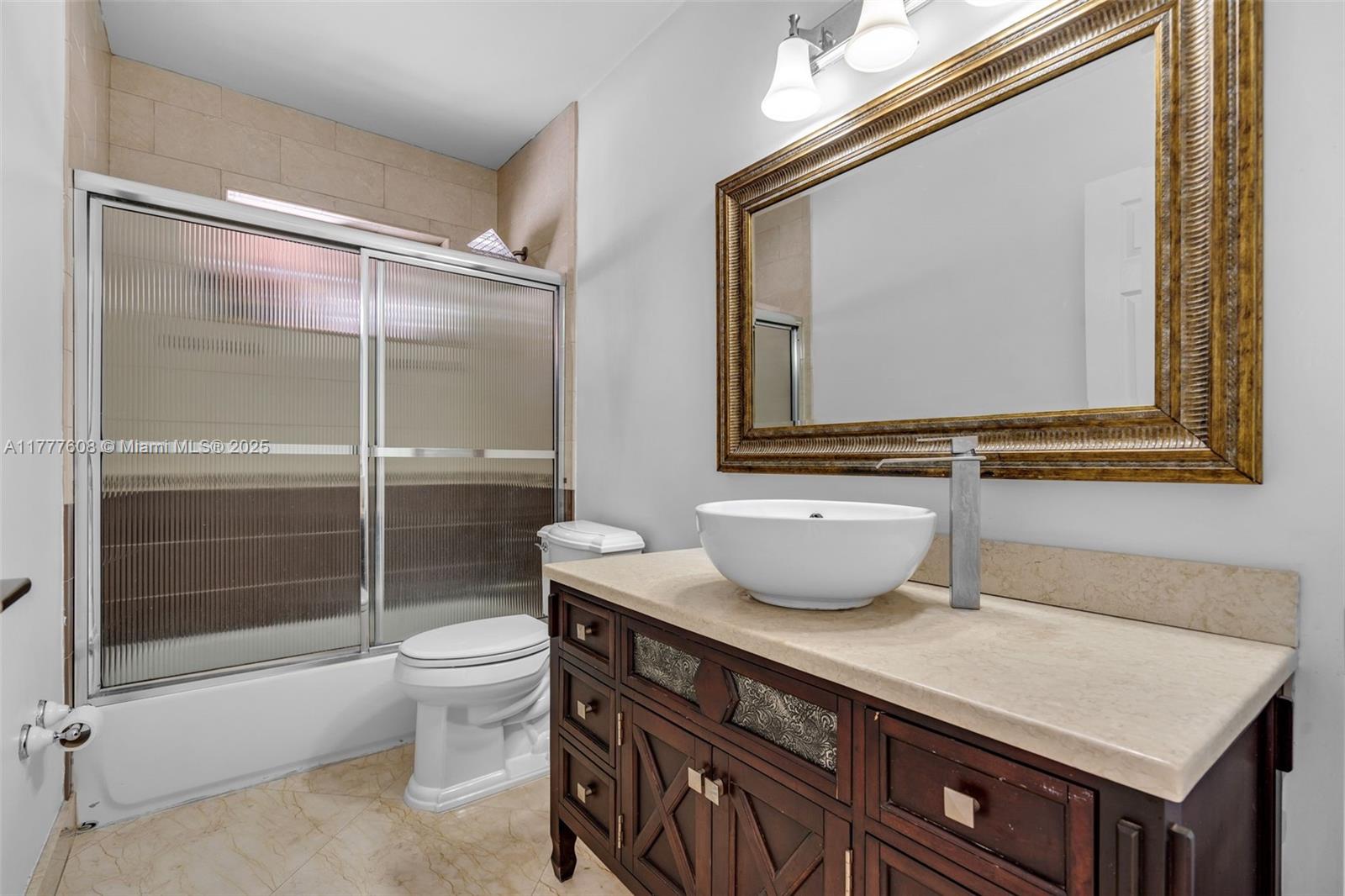 16075 Southwest 149th Terrace Miami, FL 33196 - Photo 35 of 46 a bathroom with a sink a toilet and shower