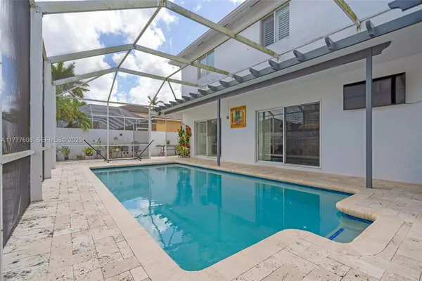 a view of a swimming pool with a patio