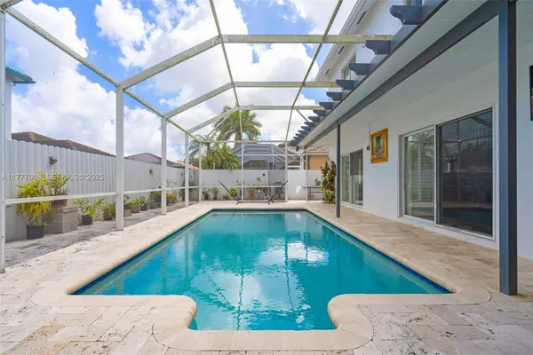 a view of a swimming pool with a patio