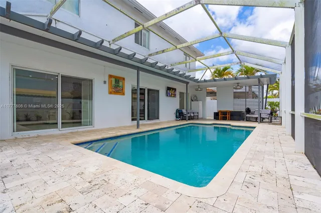 a view of a backyard with a swimming pool