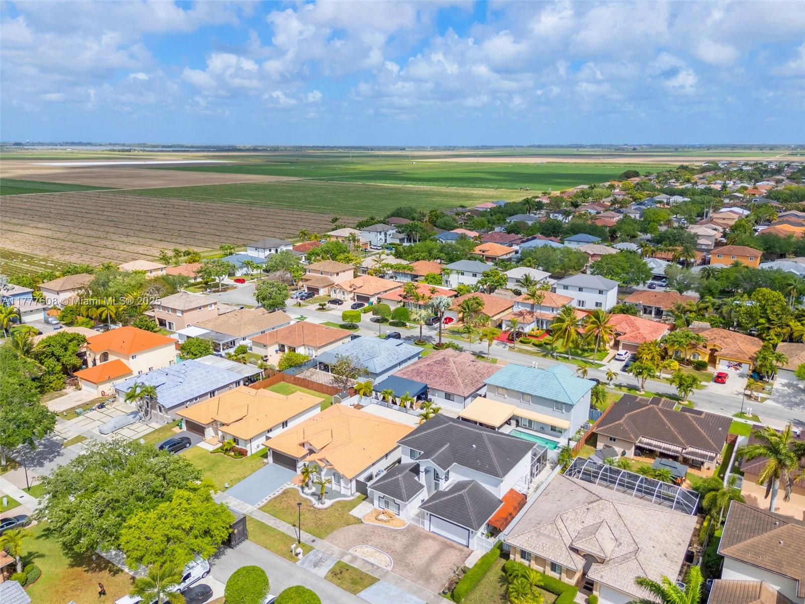 16075 Southwest 149th Terrace Miami, FL 33196 - Photo 41 of 46 an aerial view of residential building and ocean